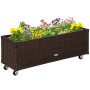 Kaffee-braunes Outsunny Hochbeet aus Rattan und Stahl mit bunten Blumen und Rollen.