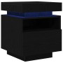 Schwarzer Nachttisch mit Schublade, Regal und LED-Beleuchtung aus Holzwerkstoff.