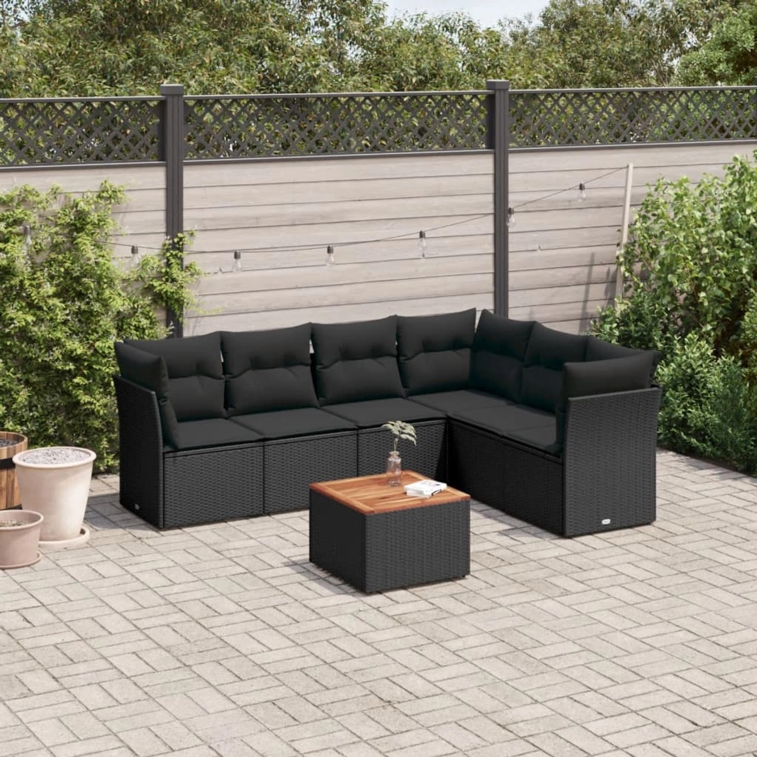 Schwarze 7-tlg. vidaXL Garten-Sofagarnitur aus Polyrattan mit Kissen und Tisch.