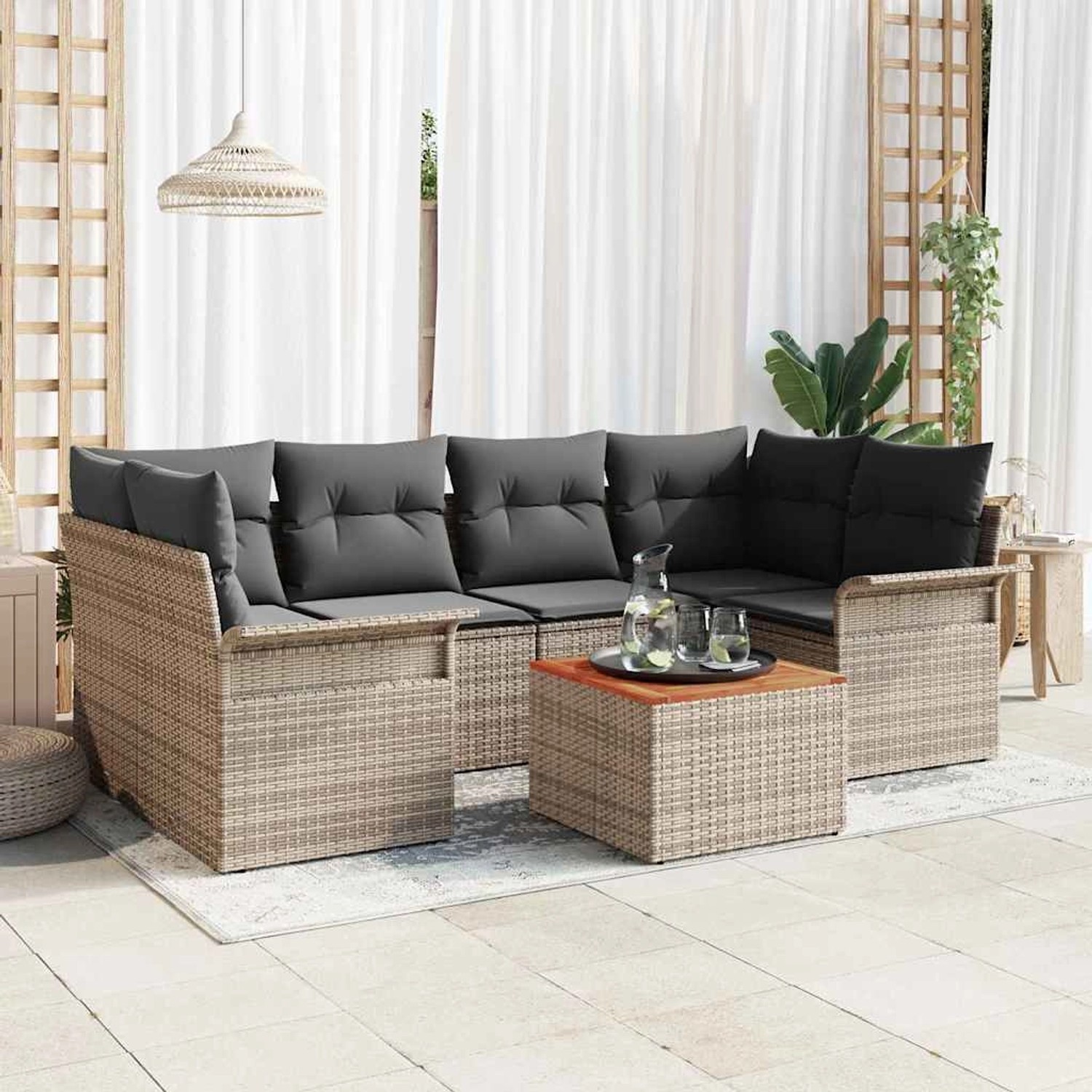 Graues 7-tlg. Garten-Sofa-Set aus Poly Rattan mit Tisch und Auflagen für Terrasse und Garten.