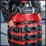 Einhell E-Case Systemkoffer Tasche, rot/schwarz, auf gestapelten Werkzeugkoffern, mit Werkzeug.