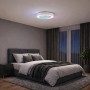 Weiße LED-Deckenleuchte Catania mit Ventilator und RGB-Lichteffekten im Schlafzimmer.