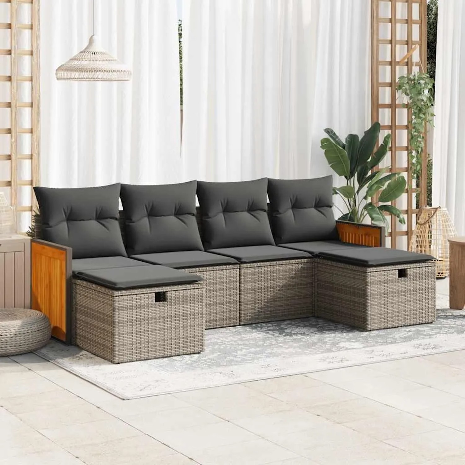 Graue 6-teilige Garten-Sofagarnitur aus Polyrattan mit Kissen und Stauraum.