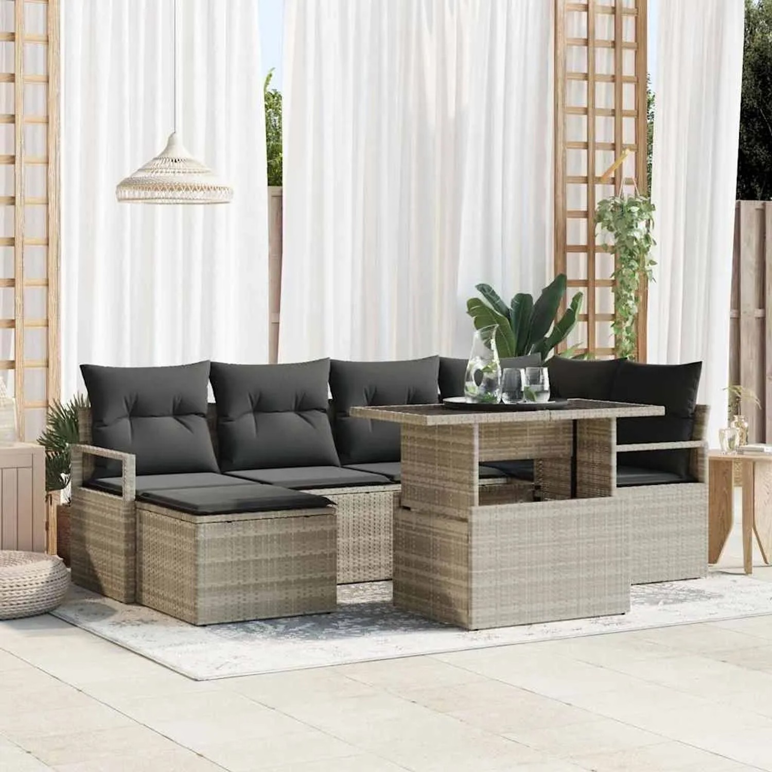 Hellgraues 7-teiliges Garten-Sofa-Set aus Poly Rattan mit Tisch und Stauraum.