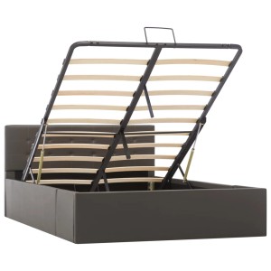 Graues vidaXL Stauraumbett aus Kunstleder (120x200 cm) mit hochgeklapptem Lattenrost.