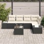 Schwarzes 6-teiliges Garten-Sofa-Set aus Poly Rattan mit Tisch und beigen Kissen.