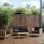 4-teiliges Lounge-Set Junee aus Polyrattan in Natur mit anthrazitfarbenen Auflagen und Holztisch.