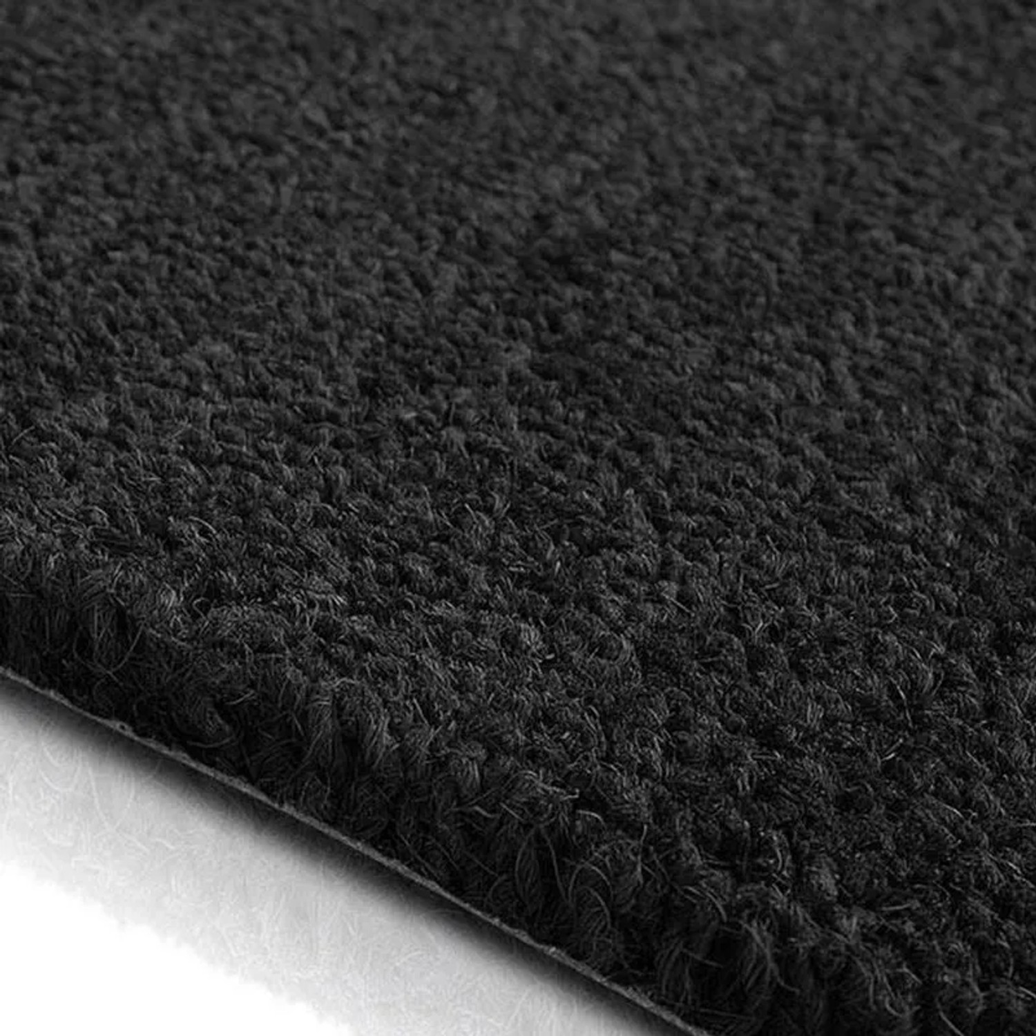 Detailaufnahme: Schwarze KARAT Kokosmatte, 40x60 cm, als Eingangsmatte und Fußabtreter.