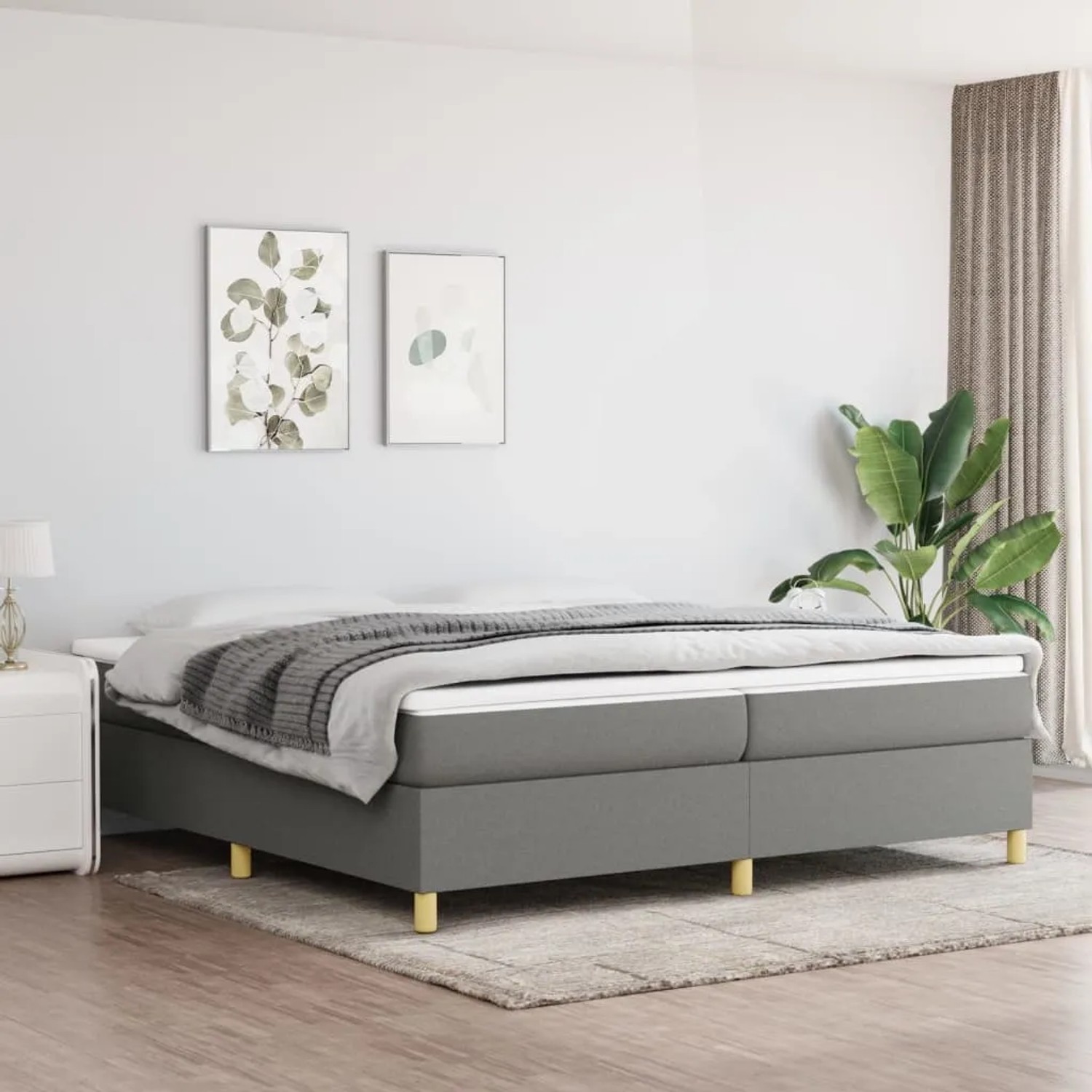 Dunkelgraues vidaXL Boxspringbett 200x200 cm aus Stoff im Schlafzimmer.
