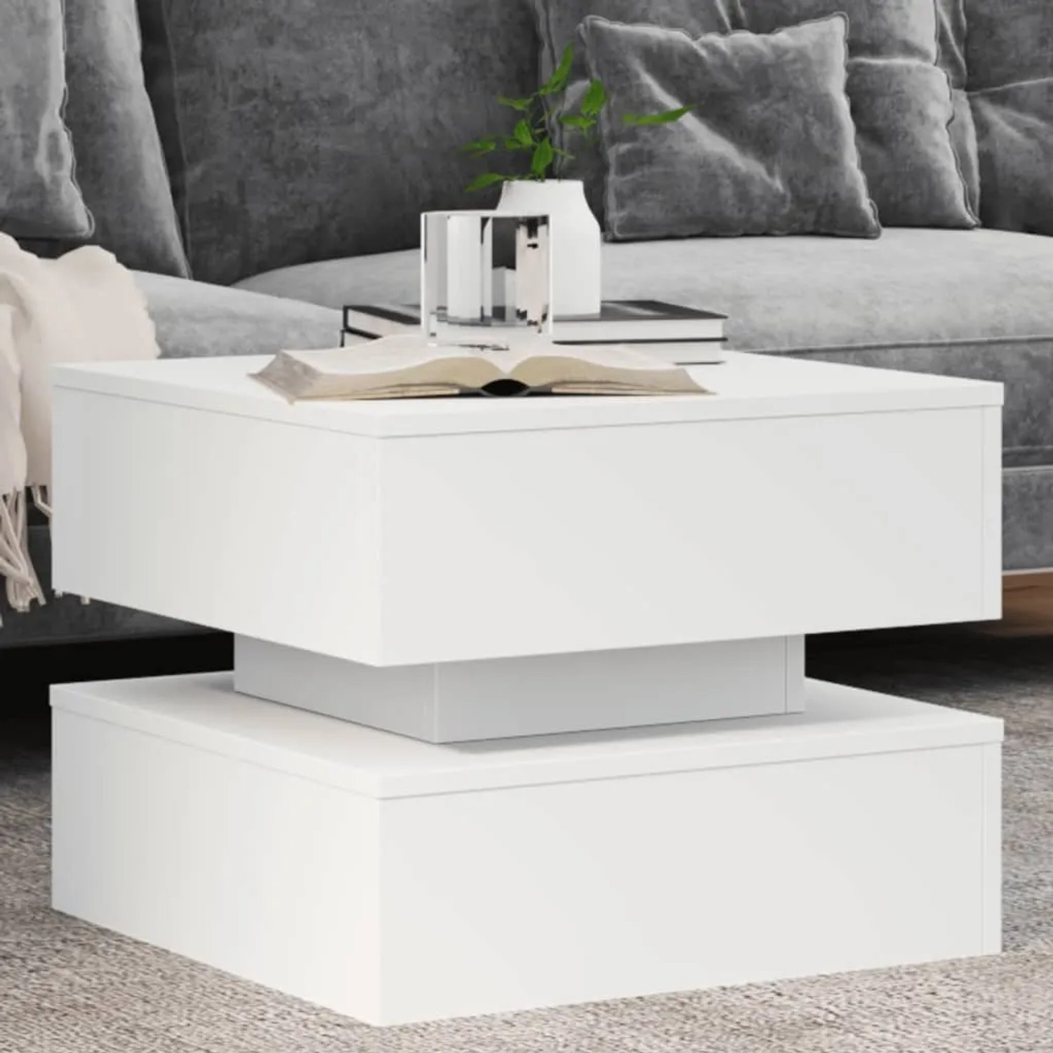 Weißer, moderner Couchtisch mit zwei Ebenen und LED-Beleuchtung. Quadratisch, aus Holzwerkstoff.
