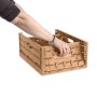 Braune PROREGAL Klappbox Active Lock im Holzdekor (40x60cm) wird von einer Hand bedient.