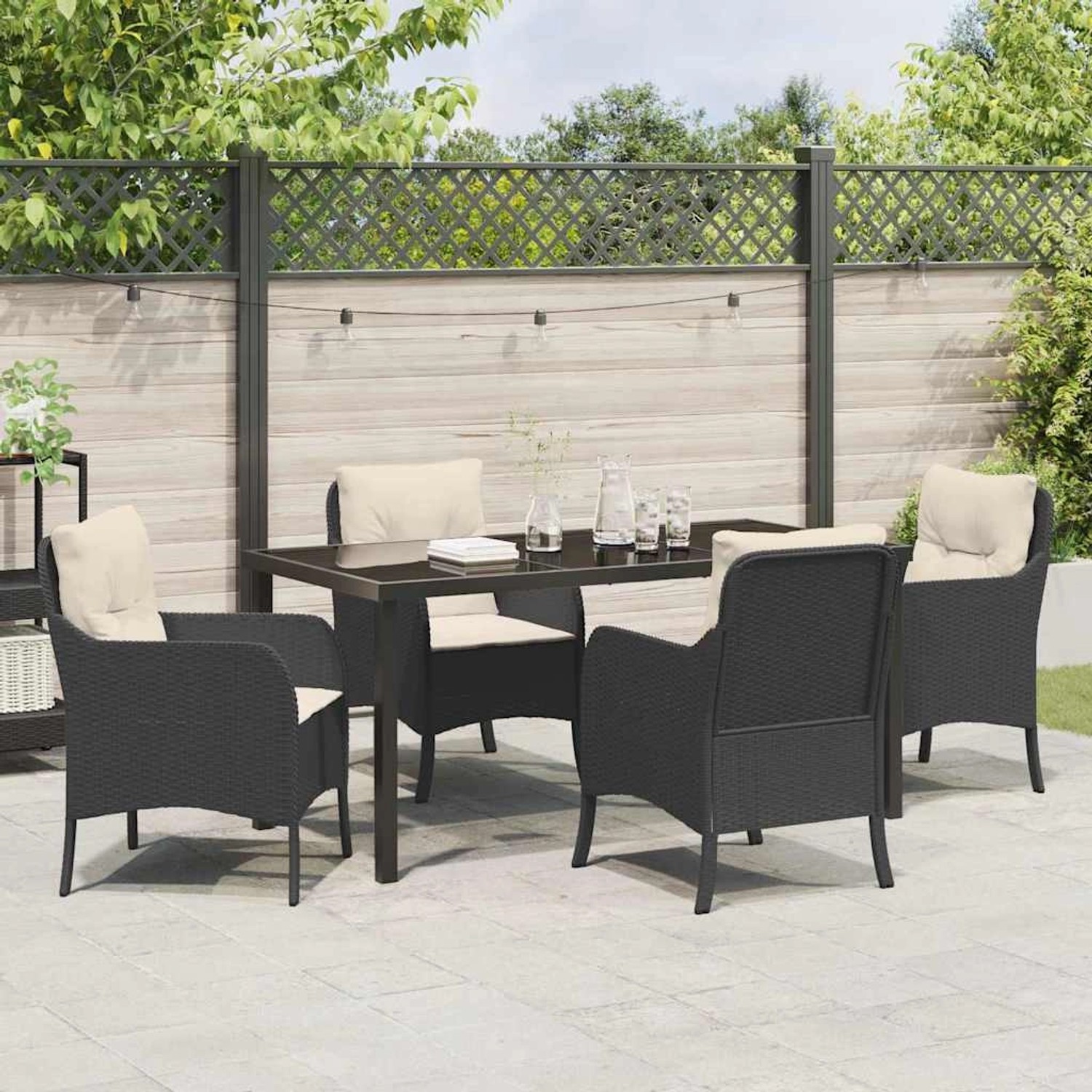 Schwarze 5-teilige Garten Essgruppe aus Poly Rattan mit Kissen. Gartenmöbel-Set für 4 Personen.