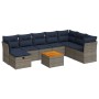 Graue 9-teilige vidaXL Garten-Sofagarnitur aus Polyrattan mit marineblauen Kissen und Tisch.