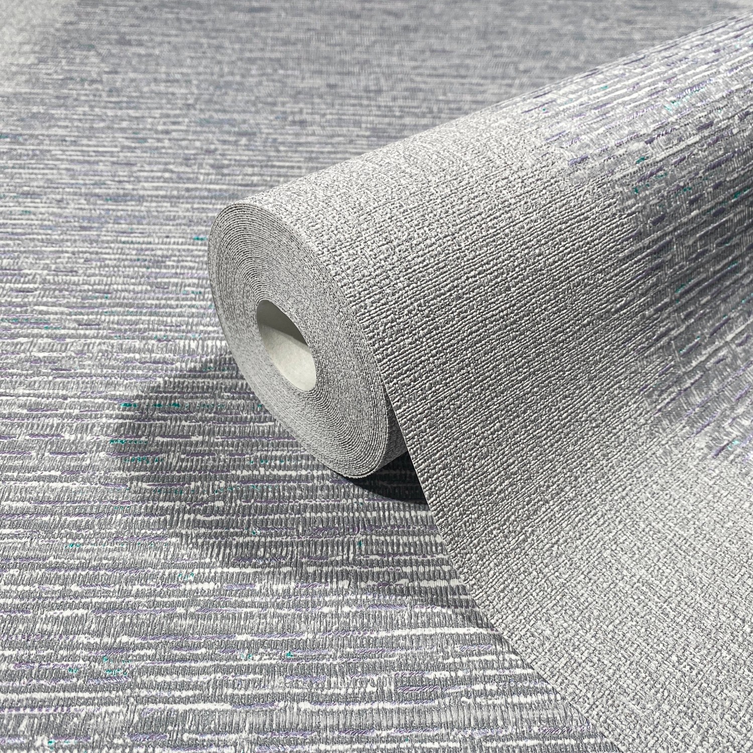 Rolle Marburg Vliestapete Papis Loveday Struktur in Grau-Blau mit feiner Textur.