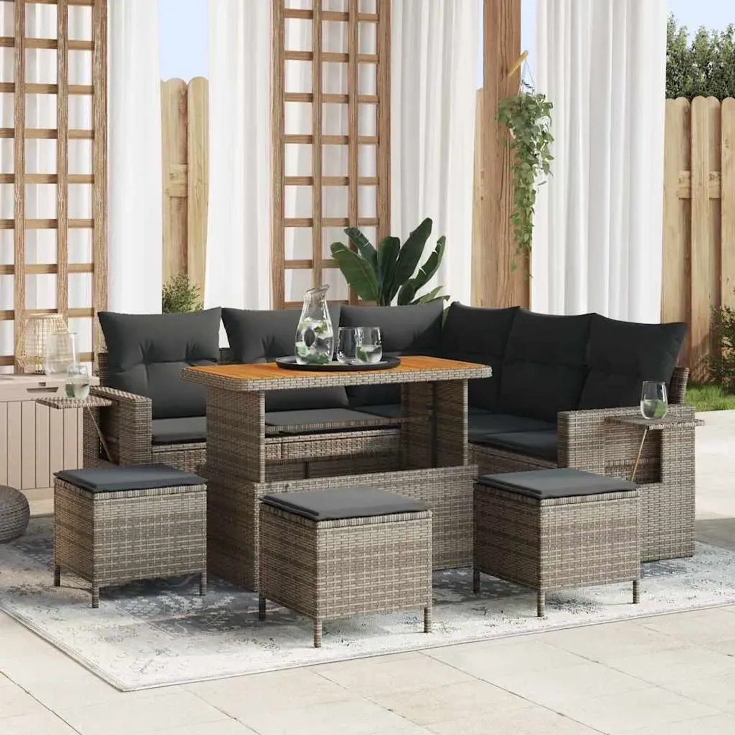 Graues 9-teiliges Garten-Sofa-Set aus Poly Rattan mit Tisch und Hockern.