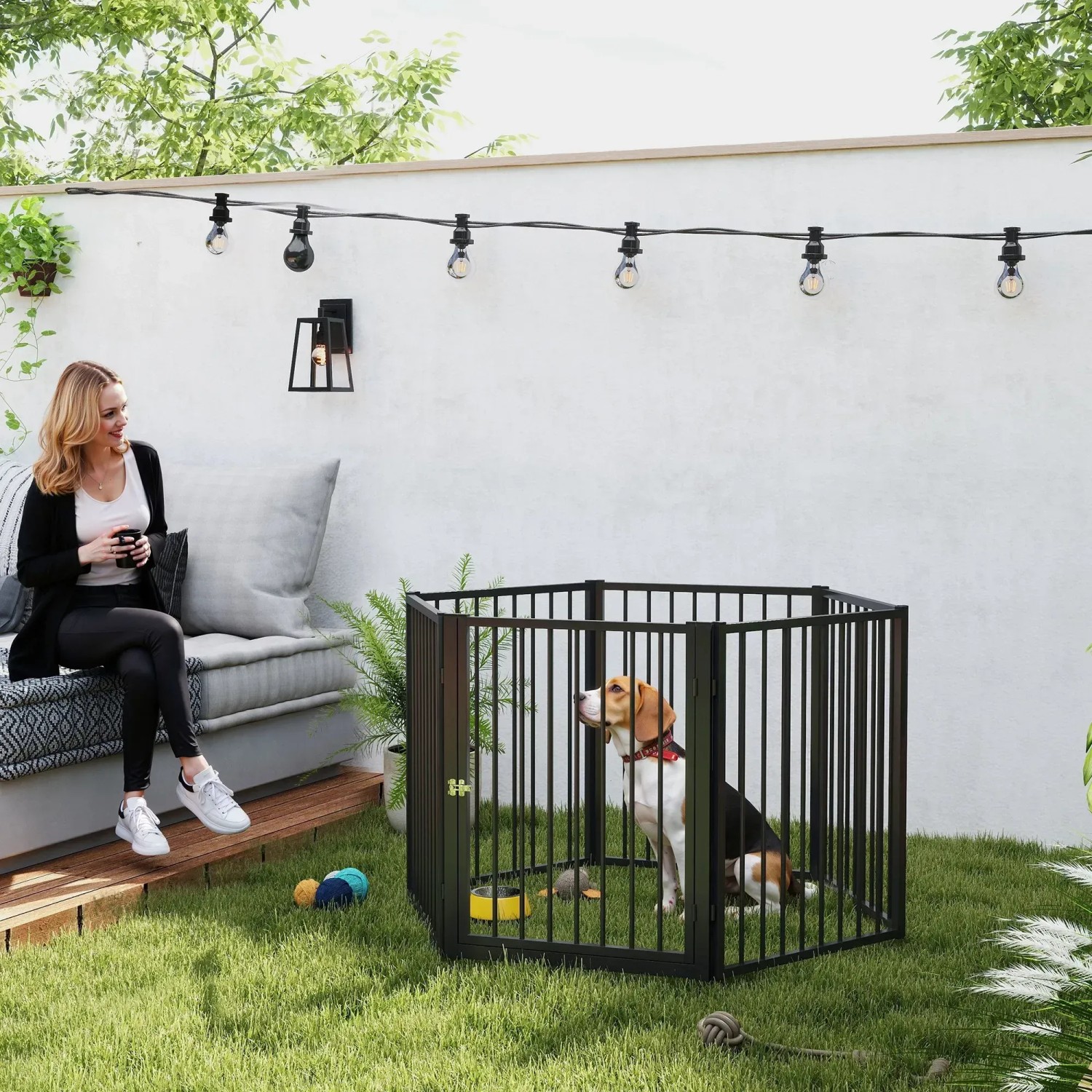 Schwarzer PawHut Welpenauslauf aus Stahl mit Hund im Garten, 240x60x76cm.