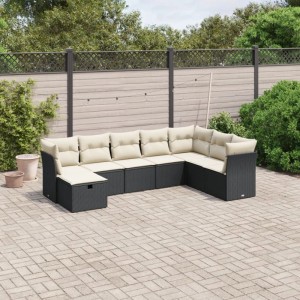Schwarze vidaXL Garten-Sofagarnitur aus Rattan mit cremefarbenen Kissen im Garten.