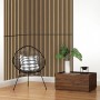 Jangal Wandpaneel Solid Teak, MDF-Furnier, 120,6x80x2,2 cm, als Akustikpaneel an einer Wand.