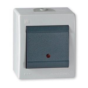 Grauer Aling-Conel Aufputz Kreuzschalter mit Glimmlampe, IP44, für Feuchträume.