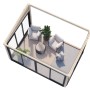 Weißes Holz-Gartenhaus mit Pultdach, 420x297 cm, eingerichtet mit Möbeln und Pflanzen.