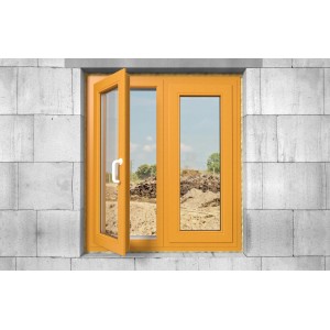 Gelber Fensterrahmen in Mauerwerk eingebaut, ein Fenster geöffnet.