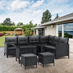 Schwarze Juskys Polyrattan Gartenlounge Manacor mit dunkelgrauen Bezügen, bestehend aus Sofa, Tisch und Hockern.