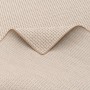 Detailansicht des beige-creme farbenen Snapstyle In & Outdoor Teppich Oslo mit Karomuster.