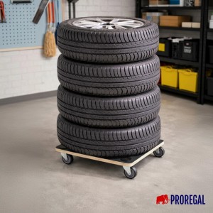 PROREGAL Transportroller HERCULES, Rollbrett aus Siebdruckplatte mit 4 Gummirollen, beladen mit Autoreifen in Garage.