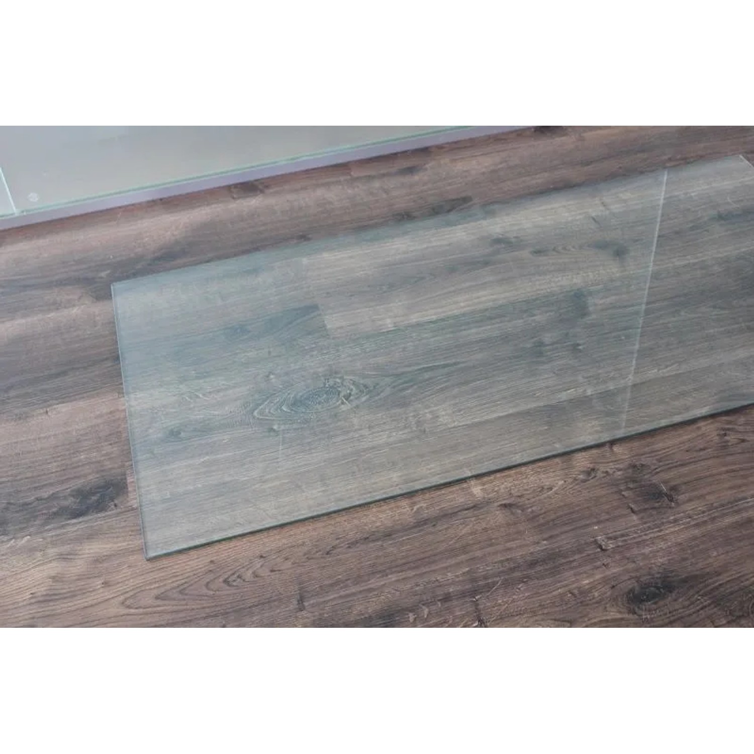Rechteckige ECOfoxx Funkenschutz Glasbodenplatte 140x50cm für Kamin und Ofen.