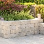 Diephaus Mauerstein Collo Muschelkalk als Gartenmauer mit Pflanzen bepflanzt.