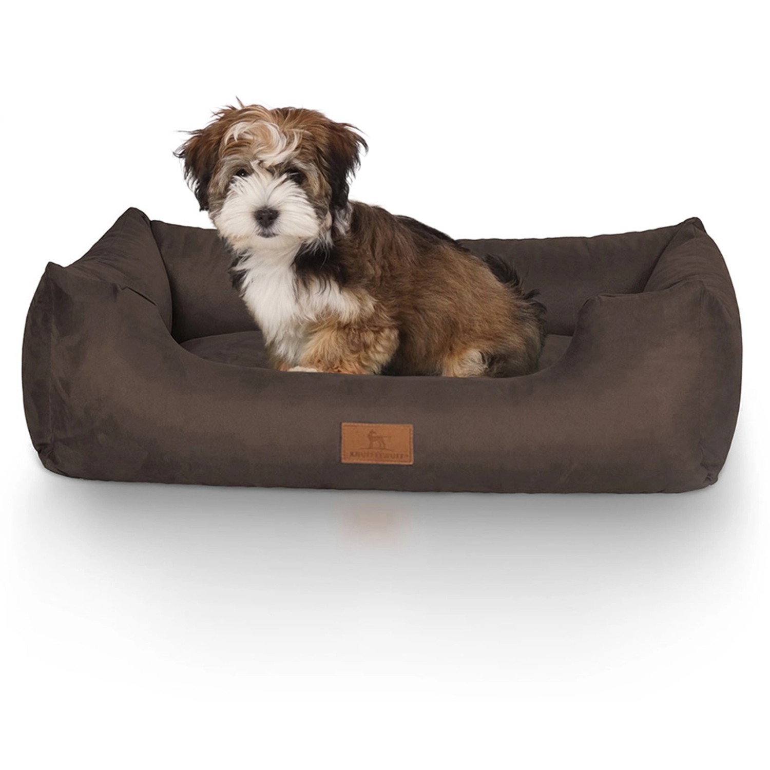 Braunes Knuffelwuff Hundebett Dreamline Velours (M-L) mit Hund.