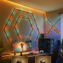 Govee Gaming-Wandleuchten 4+1 H6063 im Gaming-Zimmer, leuchtende Formen an der Wand.
