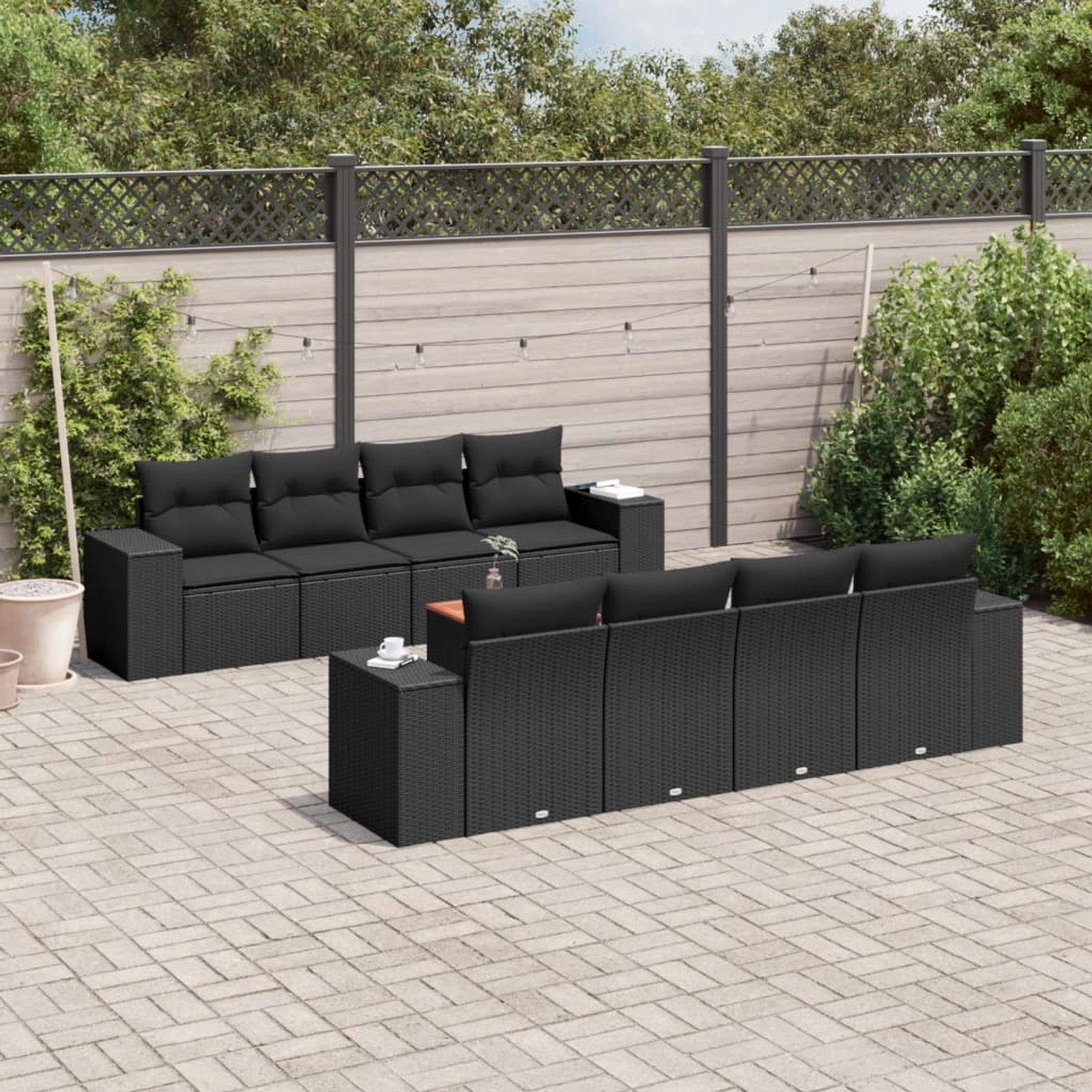 Schwarze 9-tlg. vidaXL Garten-Sofagarnitur aus Poly Rattan mit Kissen im Garten.