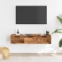 Wandschrank aus Holzwerkstoff in Altholz-Optik mit 3 Schubladen unter TV im Wohnzimmer.