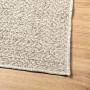 Cremefarbener vidaXL Outdoor-Teppich ZIZUR in Jute-Optik, 140x200 cm, mit gewebter PP-Textur auf Holz.