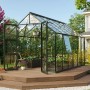Vitavia Gewächshaus Olymp 9900 Smaragd mit Fundamentrahmen auf Holzterrasse im Garten.