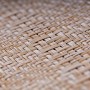 Detailaufnahme des beigen KARAT Outdoor Teppich Parma mit Flechtmuster.