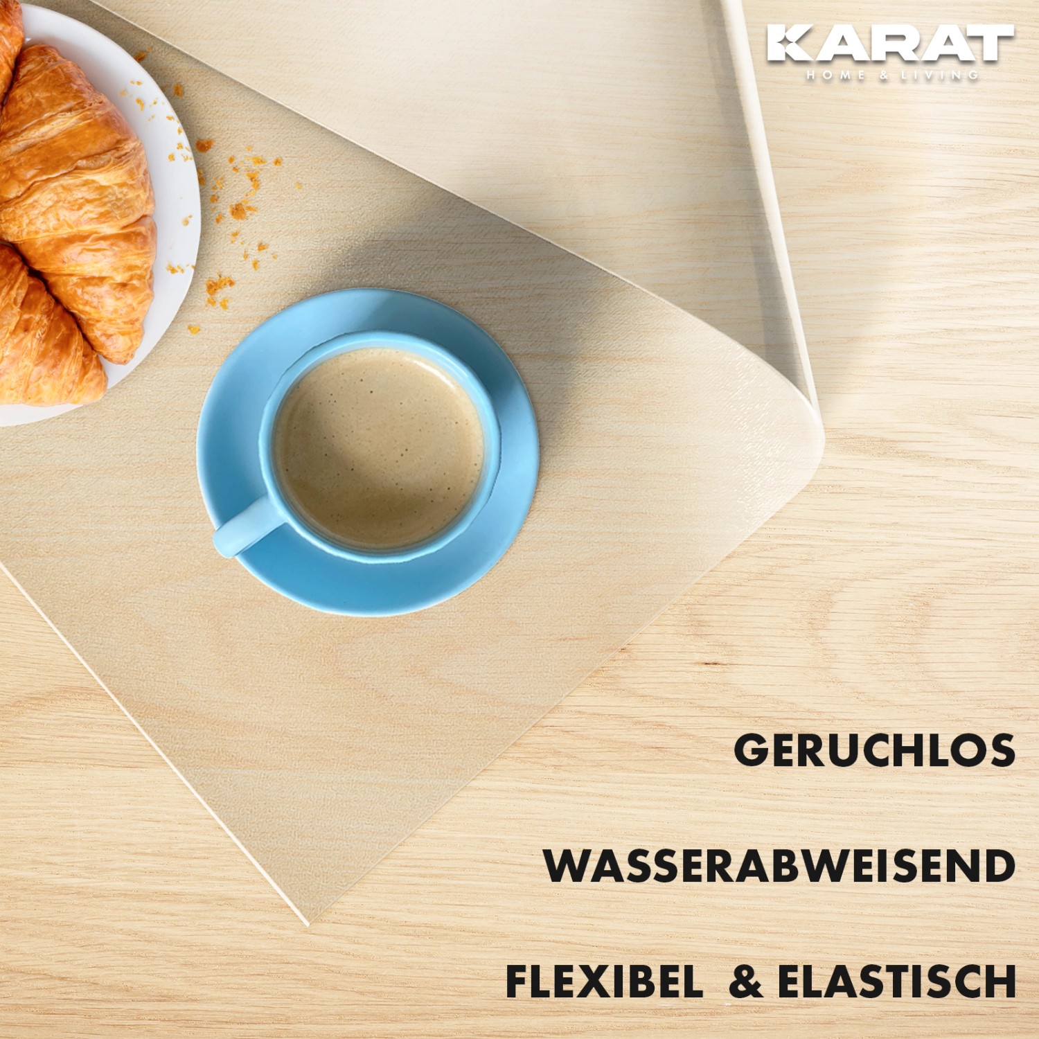 Transparente KARAT Tischfolie 95x175cm mit Kaffee und Croissant auf Holztisch.