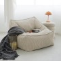 Beiger mokebo Cord Sitzsack Sessel "Der Lümmel" XXL mit Buch und Decke.