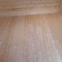 Innenansicht Gartenhaus weka Taro A: Holzwände und -boden aus Fichte, unbehandelt.