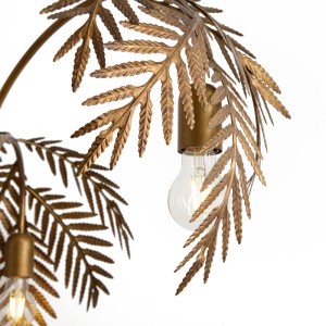 Nahaufnahme einer goldenen Vintage Stehlampe Botanica mit Blattdesign und sichtbarer Glühbirne.