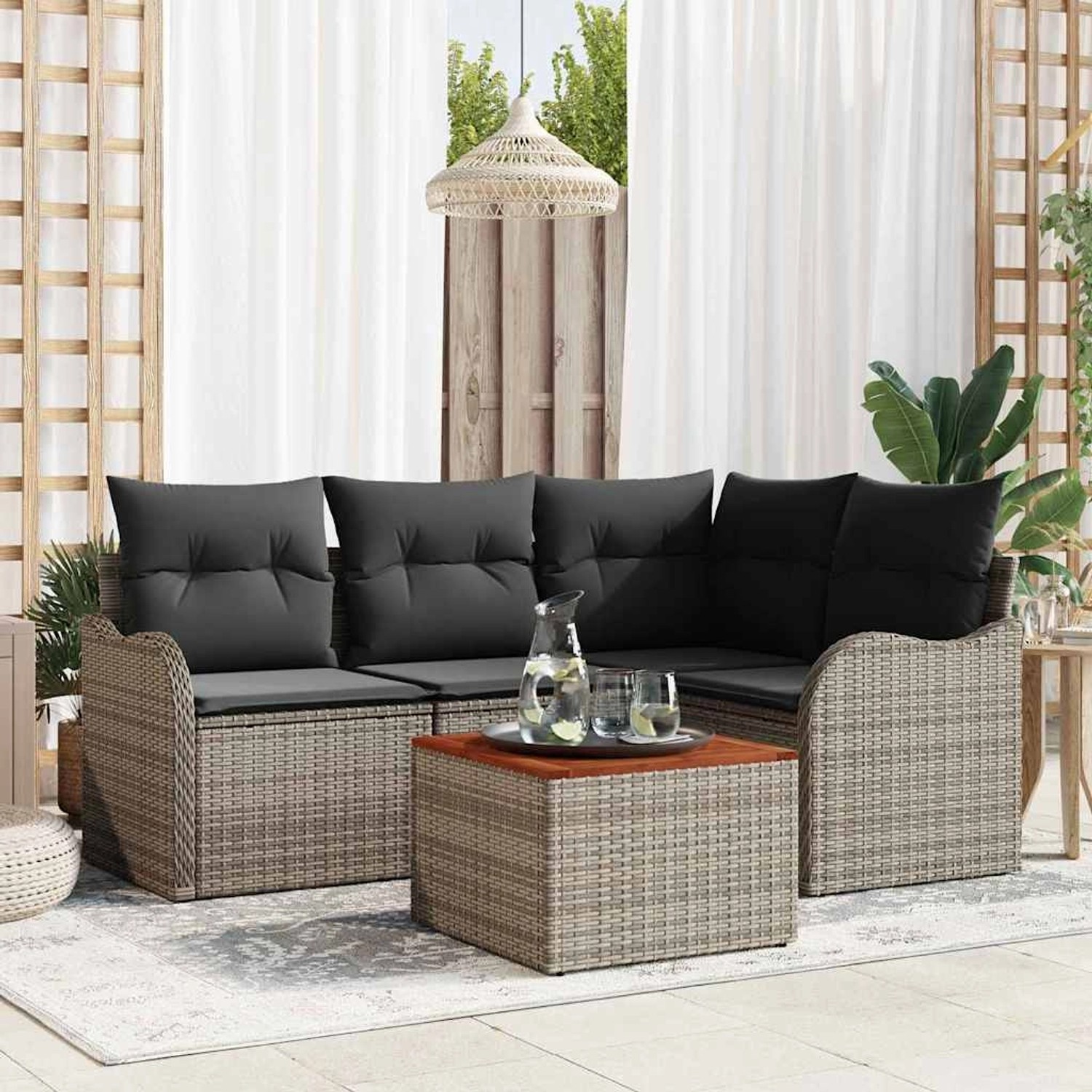 Graues 5-teiliges vidaXL Garten-Sofa-Set aus Poly Rattan mit Tisch und grauen Kissen.