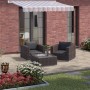 Verlegte Kann Mehrformat-Pflaster Parchetto Beton Cappuccino auf Terrasse mit Gartenmöbeln.