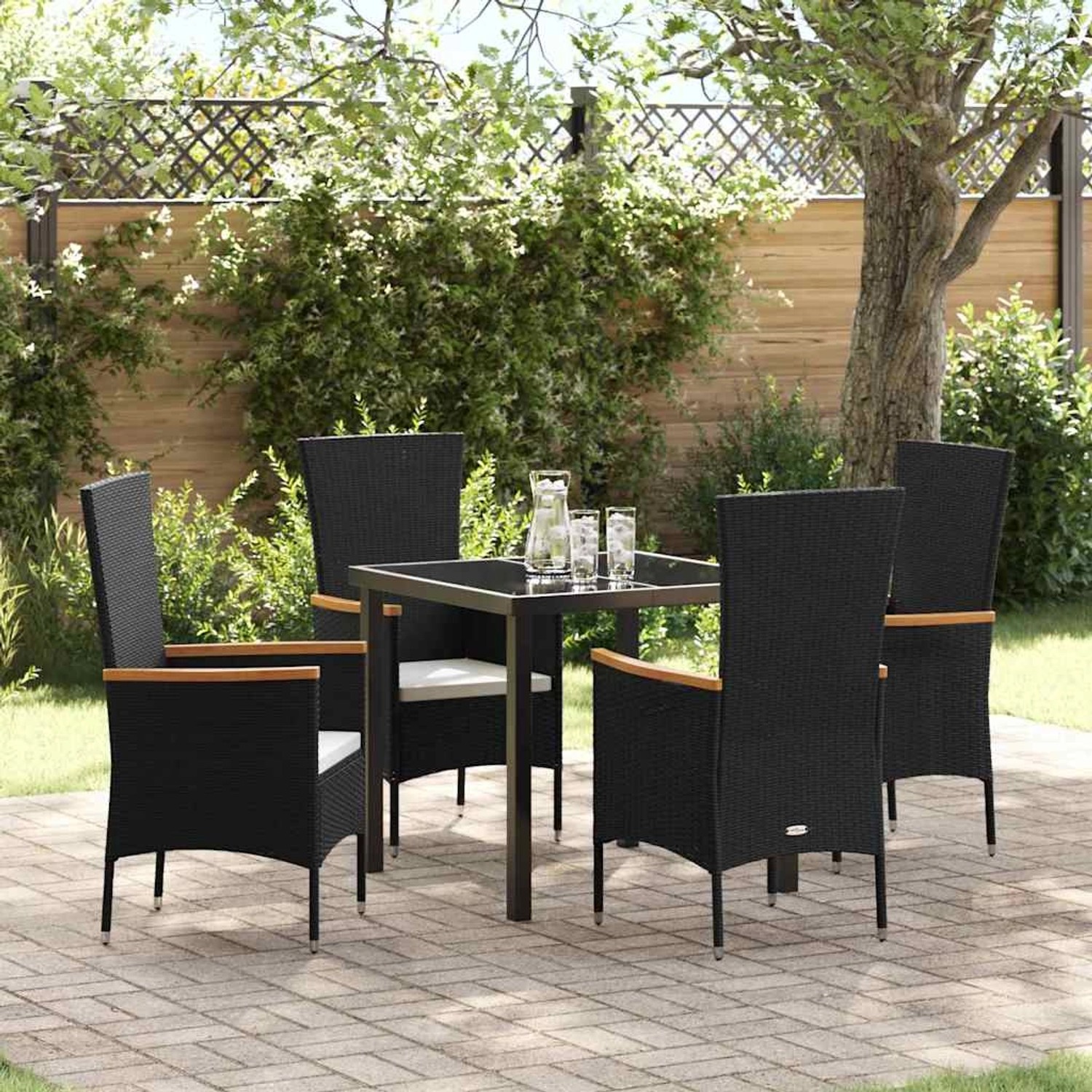 Schwarze 5-teilige vidaXL Garten Essgruppe aus Polyrattan mit Tisch und Stühlen inklusive Kissen.