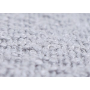 Nahaufnahme des grauen Boucle-Stoffs vom PROREGAL Hocker. Zeigt die feine Textur des Bezugs.