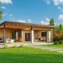 Lasita Maja Ferienhaus Domeo 10 aus Holz mit Anbau und Pultdach im Garten.