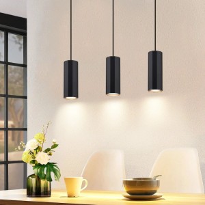 Drei schwarze, zylindrische NETTLIFE Pendelleuchten aus Metall im Industrial-Design über einem Esstisch.