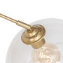 Detailaufnahme: Moderne Bogenlampe Arc aus Messing mit klarem Glas, Innenleuchte.