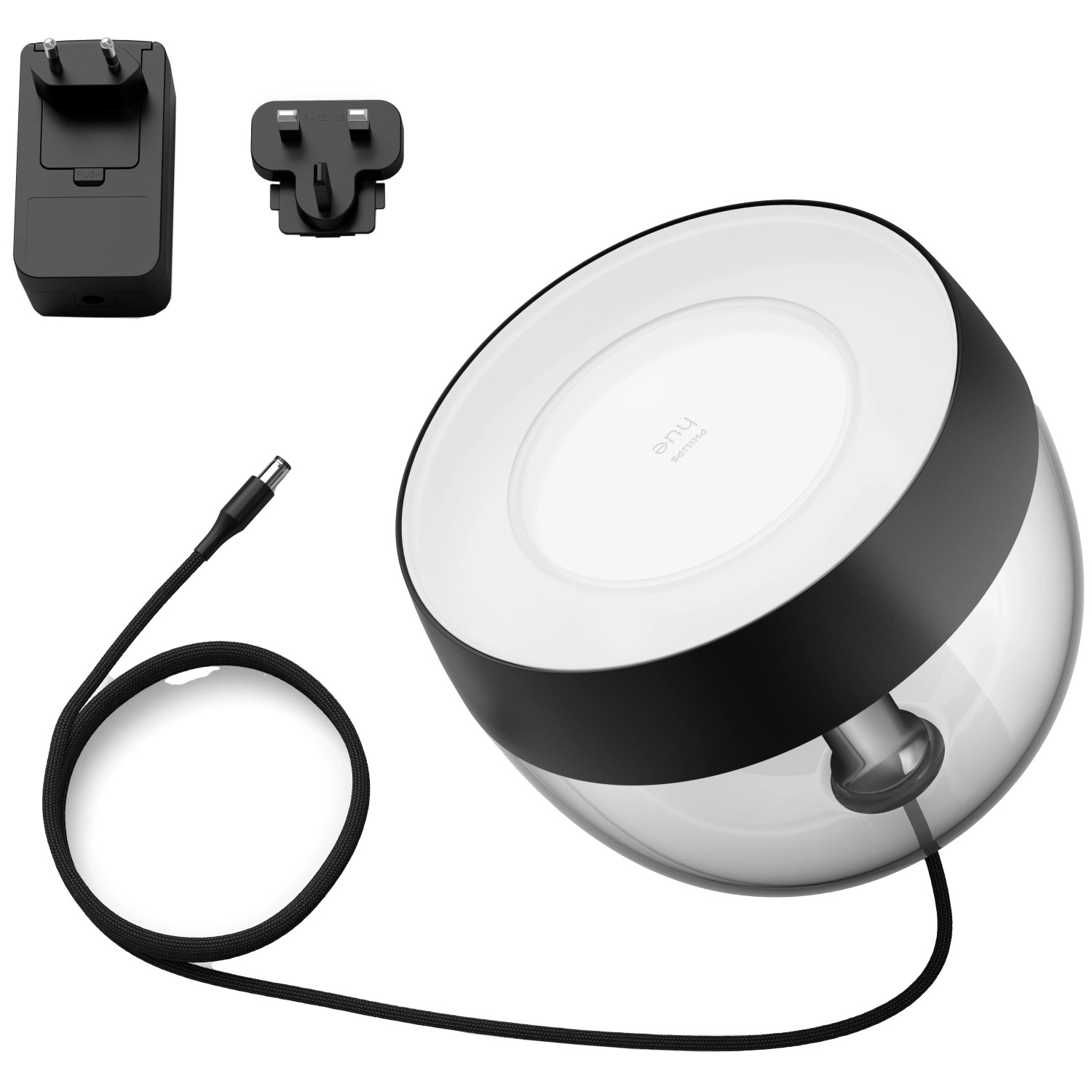 Philips Hue Iris Tischleuchte, schwarz, mit Zubehör wie Netzteil und Steckeradaptern.