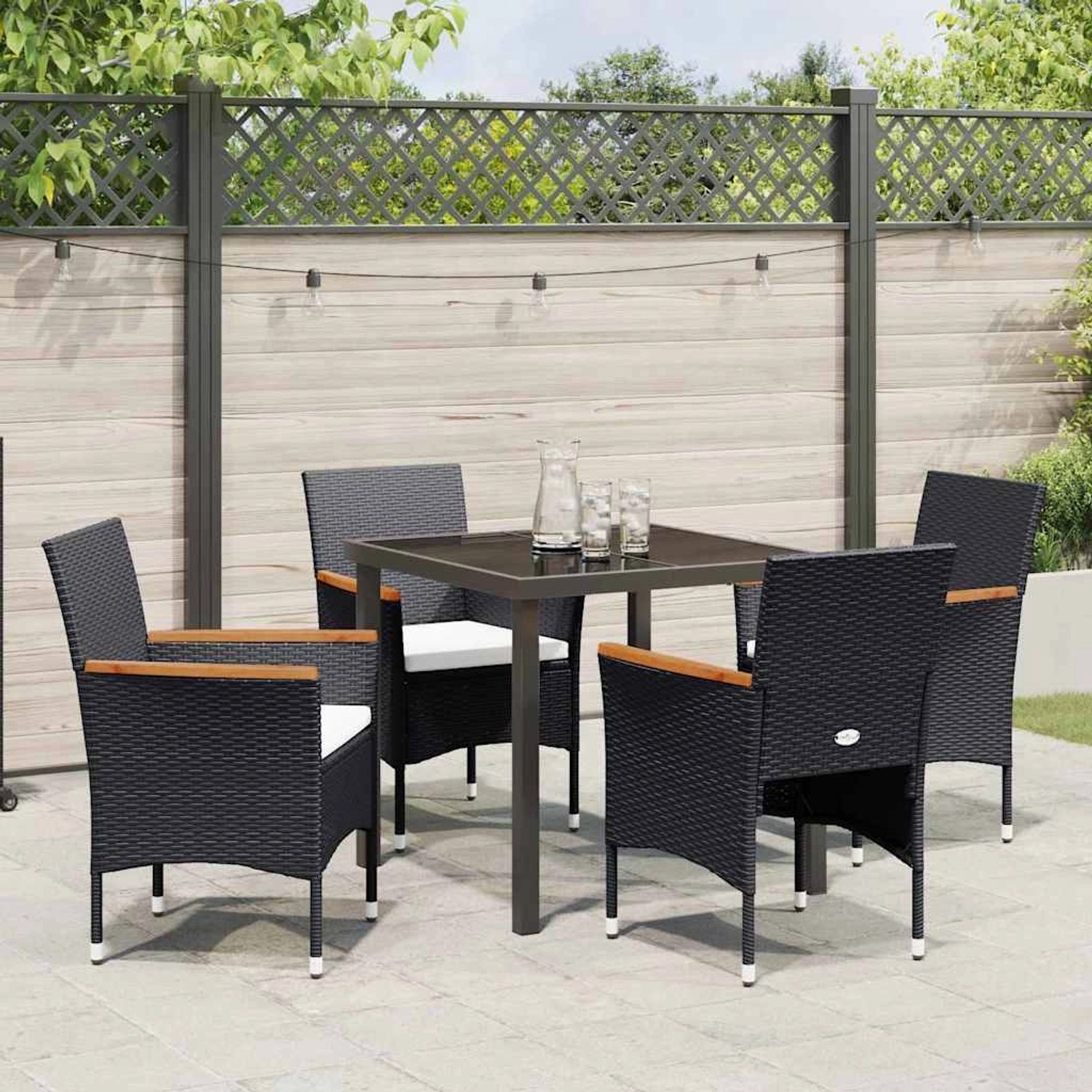 Schwarze 5-tlg. vidaXL Garten Essgruppe aus Poly Rattan mit Tisch, Stühlen und Kissen.